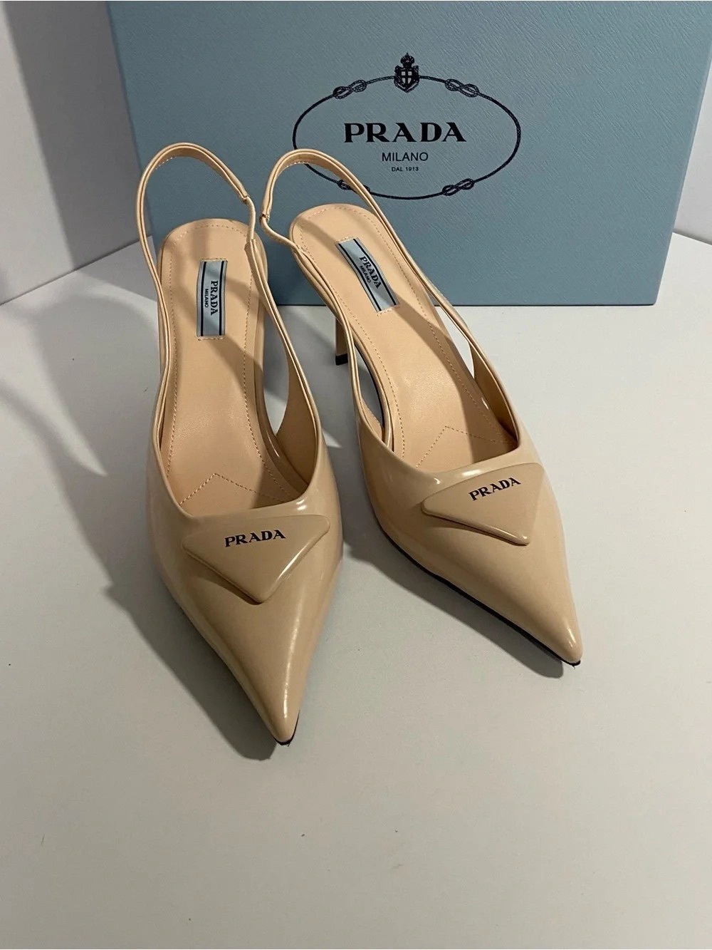 Prada Beige Patent Leather Pointed-Toe
Slingback Pumps
